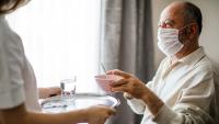 Male patient eats meal